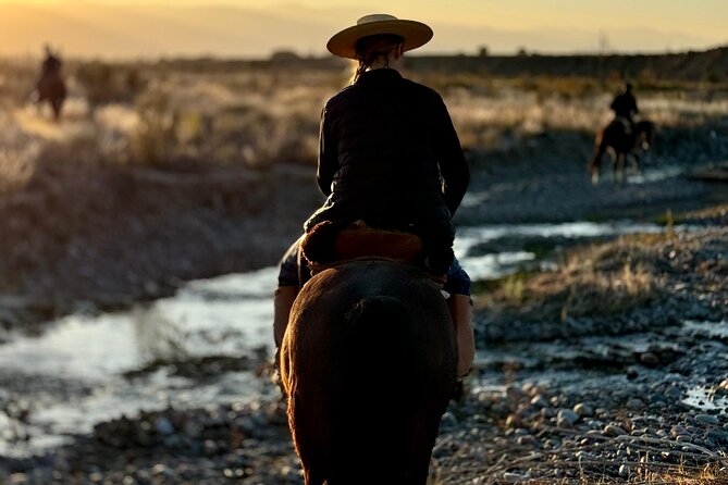 Horseback riding and lodging in Mendoza - Riding through vineyards, groves, and river country