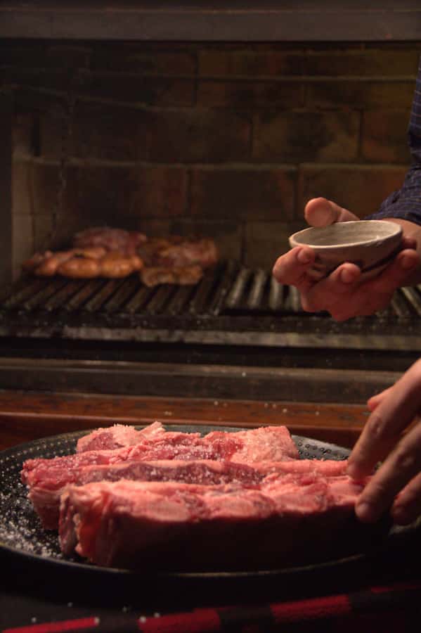 Secrets of Asado in Buenos Asado, BBQ and Dinner - Tira de asado and bife de chorizo from the grill